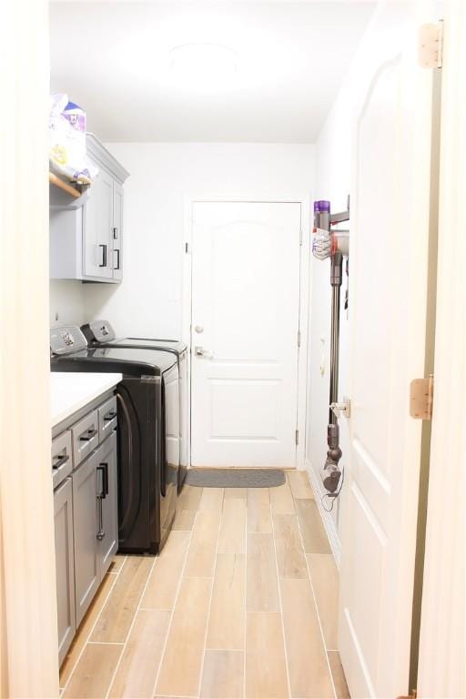 6834 Boardwalk Ave, Corpus Christi, TX 78414 - laundry area with washer and clothes dryer and cabinet space