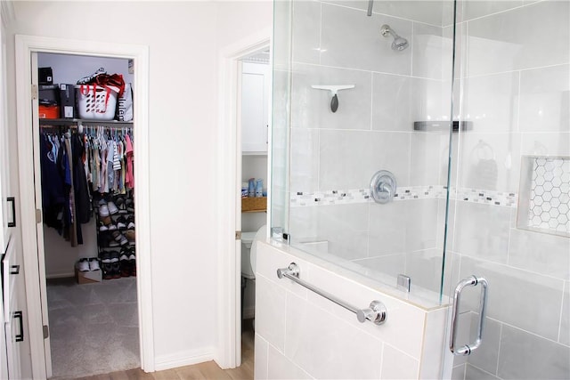 6834 Boardwalk Ave, Corpus Christi, TX 78414 - bathroom featuring a walk in closet and a shower stall