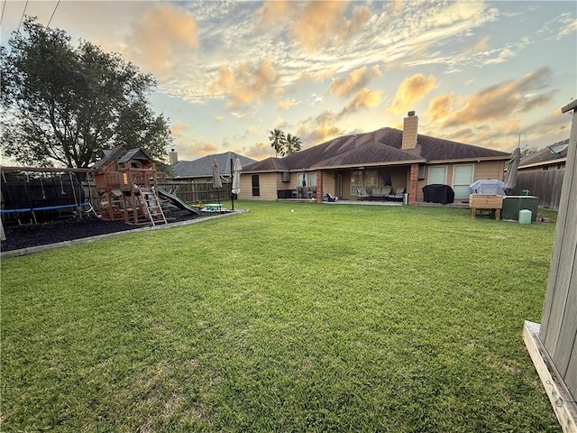 6834 Boardwalk Ave, Corpus Christi, TX 78414 - view of yard with a fenced backyard, a patio area, and a playground