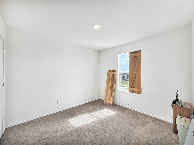 unfurnished bedroom with carpet