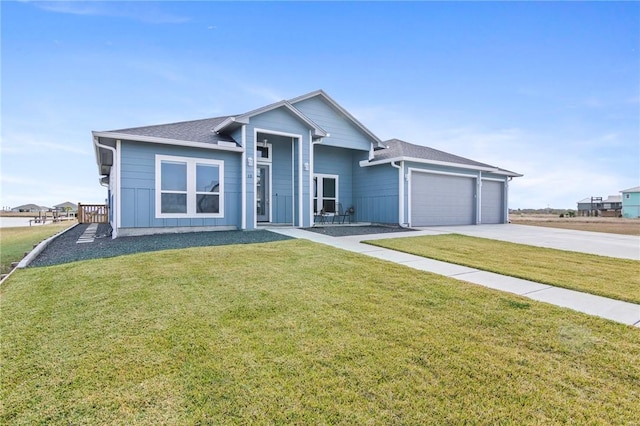 ranch-style house featuring a front lawn and a garage