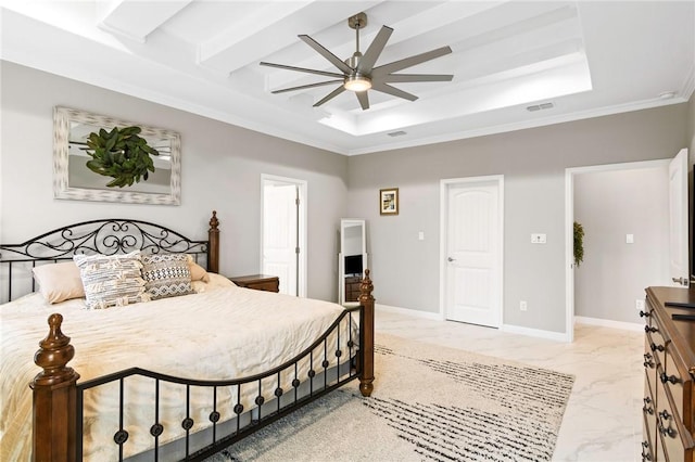 bedroom with ceiling fan, ornamental molding, and a tray ceiling