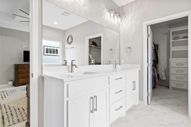 bathroom with vanity and ceiling fan