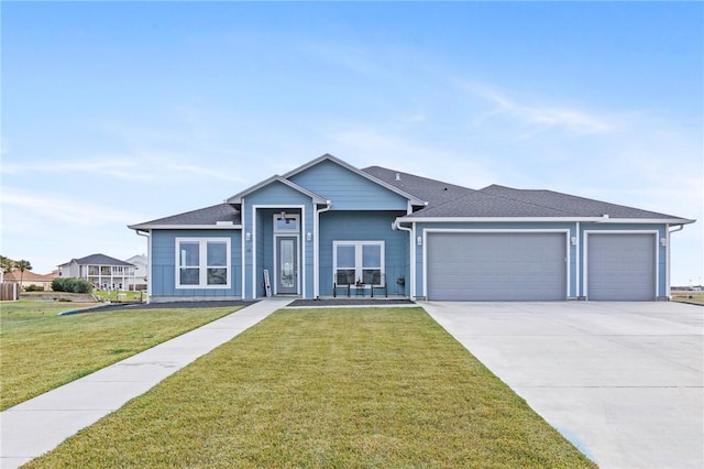 ranch-style house featuring a garage and a front lawn