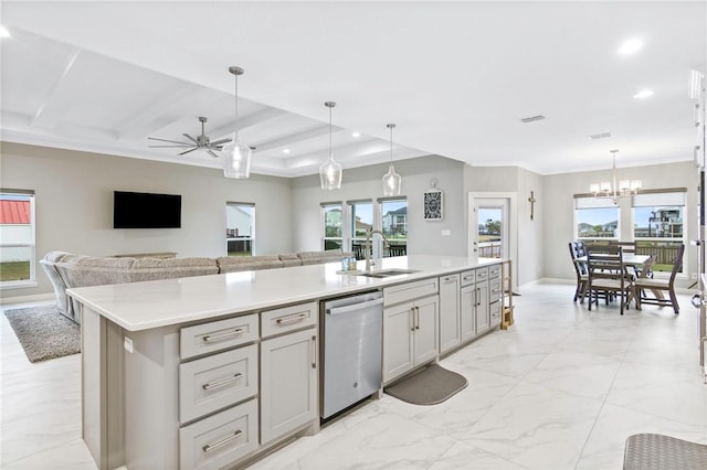 kitchen with stainless steel dishwasher, sink, hanging light fixtures, and an island with sink