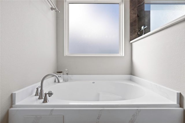 bathroom featuring a tub to relax in