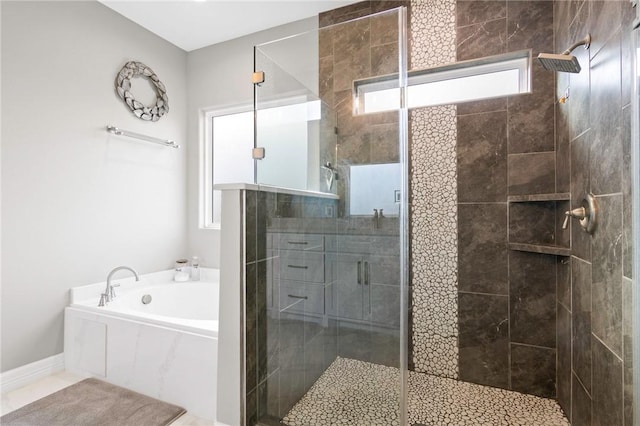 bathroom featuring shower with separate bathtub