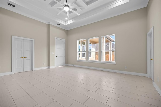 unfurnished bedroom with visible vents, ceiling fan, baseboards, and a towering ceiling