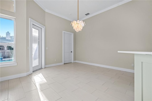 unfurnished room with visible vents, plenty of natural light, an inviting chandelier, and ornamental molding