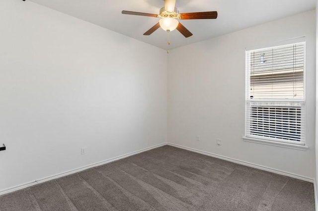 carpeted empty room with baseboards and ceiling fan