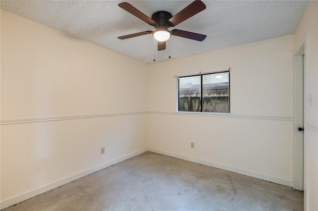 spare room featuring a textured ceiling