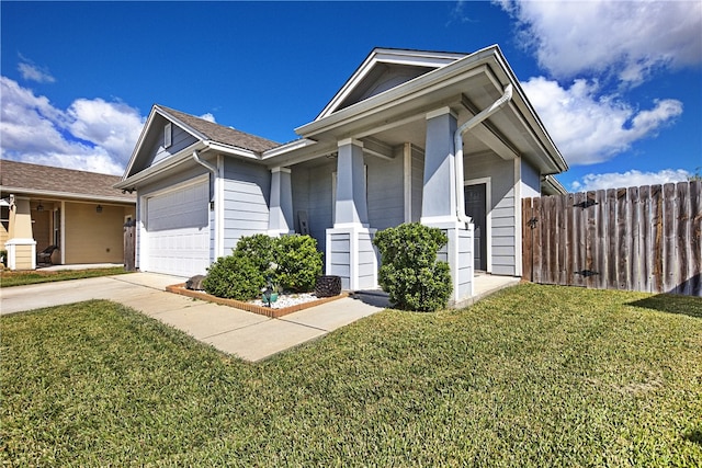 view of front of home featuring a garage and a front yard