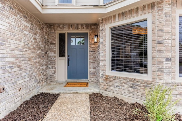 entrance to property with brick siding