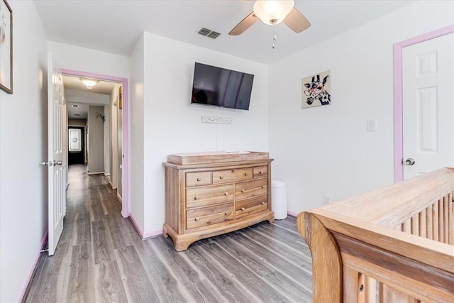 109 Misty Ln, Aransas Pass, TX 78336 - bedroom featuring wood finished floors, a ceiling fan, and baseboards