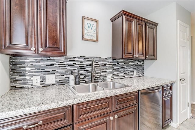 109 Misty Ln, Aransas Pass, TX 78336 - kitchen with stainless steel dishwasher, a sink, backsplash, baseboards, and dark brown cabinets