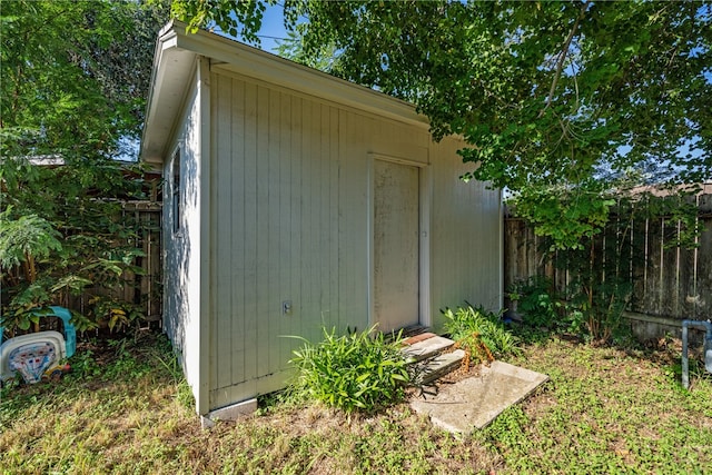 view of shed with a fenced backyard