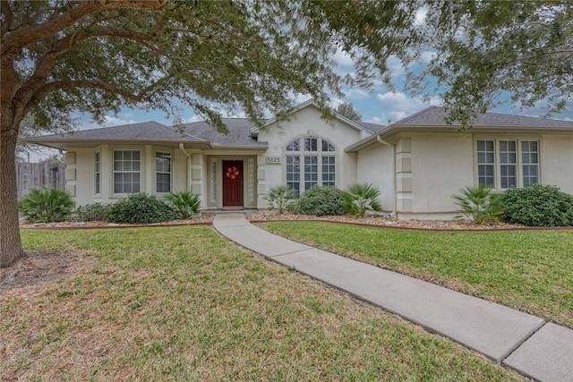 ranch-style house featuring a front lawn