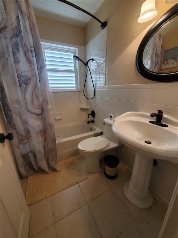5701 Glen Arbor Dr, Corpus Christi, TX 78412 - full bath with tile walls, tile patterned flooring, shower / tub combo, and toilet
