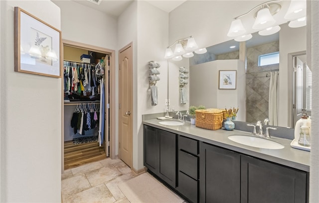 8130 Resplandor St, Corpus Christi, TX 78414 - full bath featuring double vanity, tiled shower, and a spacious closet
