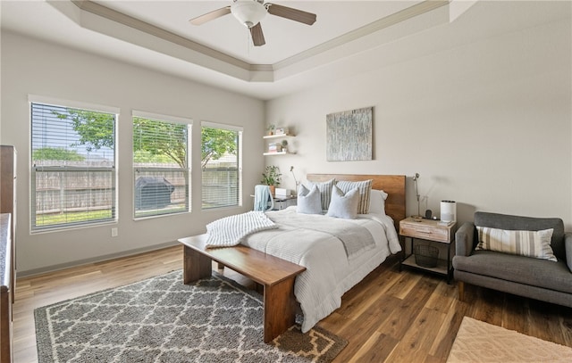 8130 Resplandor St, Corpus Christi, TX 78414 - bedroom featuring a raised ceiling, ornamental molding, wood finished floors, and ceiling fan
