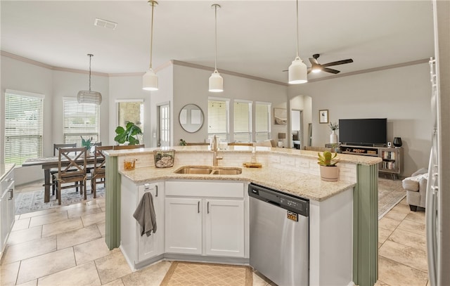 8130 Resplandor St, Corpus Christi, TX 78414 - kitchen featuring stainless steel dishwasher, a sink, open floor plan, ornamental molding, and light stone counters