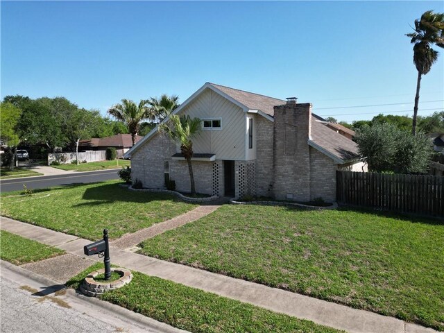 5202 Wentworth Dr, Corpus Christi, TX 78413 - view of property exterior featuring brick siding and a chimney