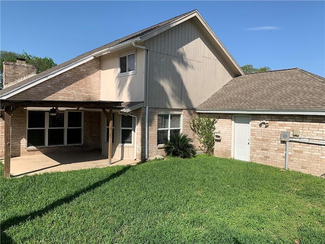 5202 Wentworth Dr, Corpus Christi, TX 78413 - back of property featuring brick siding, a yard, a chimney, a patio, and ceiling fan