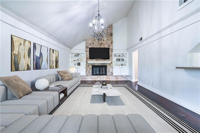 5202 Wentworth Dr, Corpus Christi, TX 78413 - living room with built in features, a chandelier, wood finished floors, high vaulted ceiling, and a fireplace