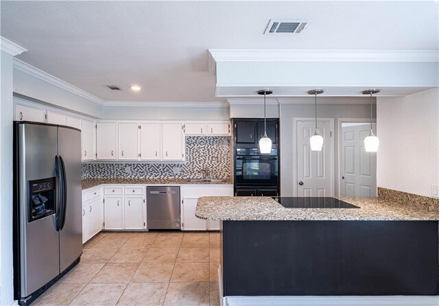 5202 Wentworth Dr, Corpus Christi, TX 78413 - kitchen with black appliances, a peninsula, light stone countertops, white cabinets, and ornamental molding