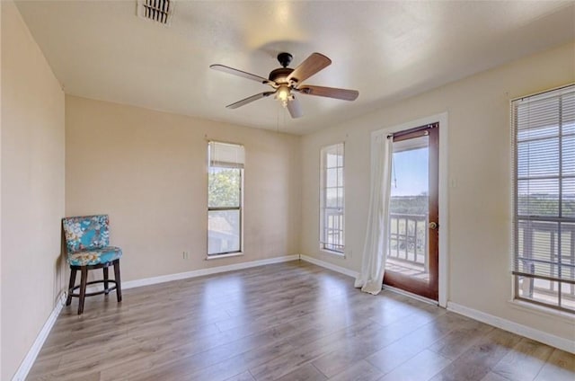 unfurnished room with ceiling fan and light hardwood / wood-style flooring