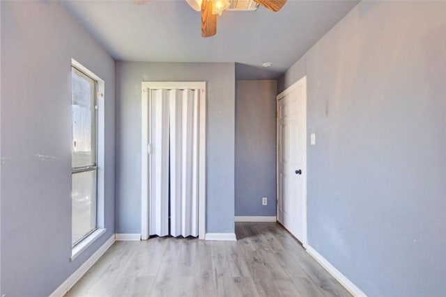 spare room featuring ceiling fan and light hardwood / wood-style flooring