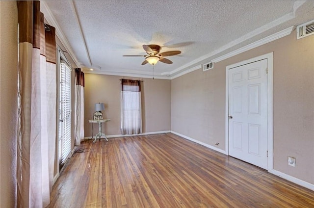 unfurnished bedroom with wood-type flooring, a textured ceiling, ceiling fan, and ornamental molding