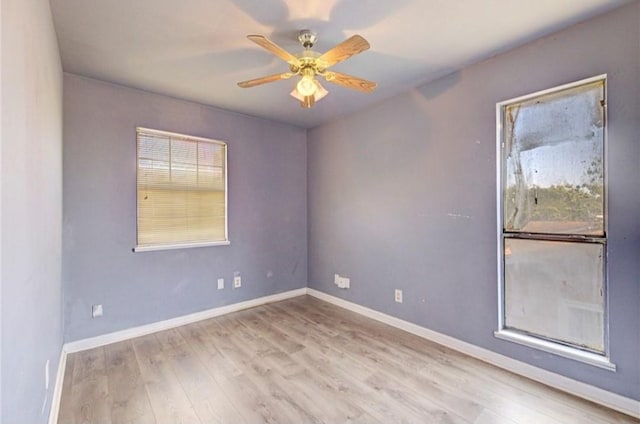 spare room featuring ceiling fan and light wood-type flooring