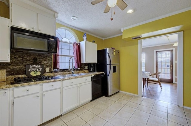 kitchen with white cabinets, sink, backsplash, and black appliances