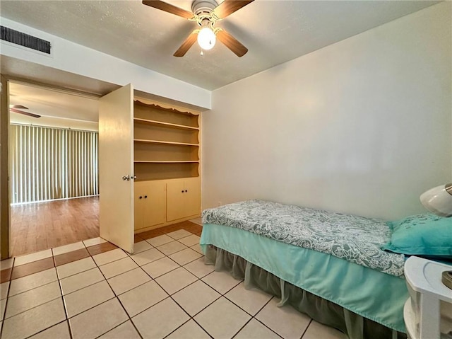 919 W W Ave Unit G, Kingsville, TX 78363 - bedroom with light tile patterned floors and a ceiling fan