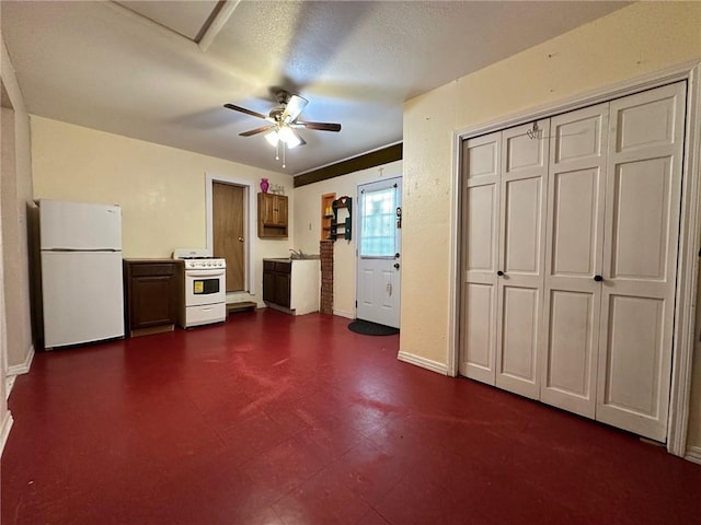 919 W W Ave Unit G, Kingsville, TX 78363 - kitchen featuring white appliances, ceiling fan, and dark flooring