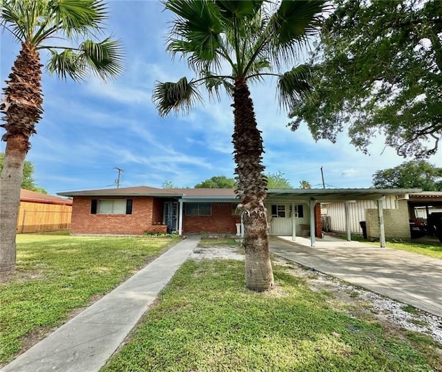 919 W W Ave Unit G, Kingsville, TX 78363 - ranch-style home with brick siding, driveway, and an attached carport