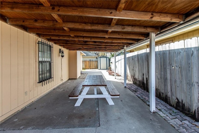 view of patio / terrace featuring a storage unit