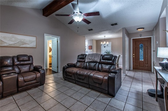 living room featuring a textured ceiling, tile patterned flooring, and lofted ceiling with beams