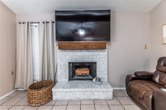 living room featuring a textured ceiling and light tile patterned floors