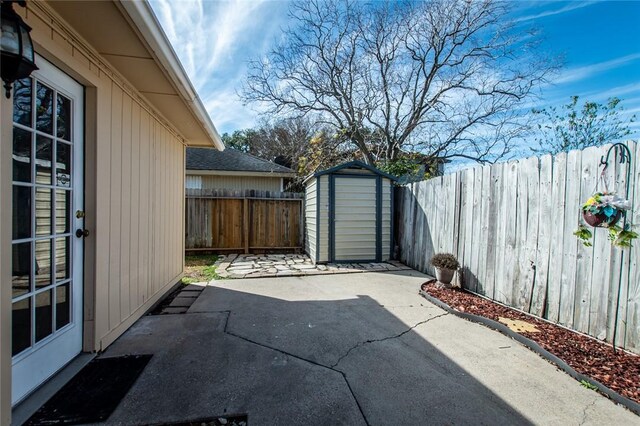 view of patio / terrace featuring a storage shed