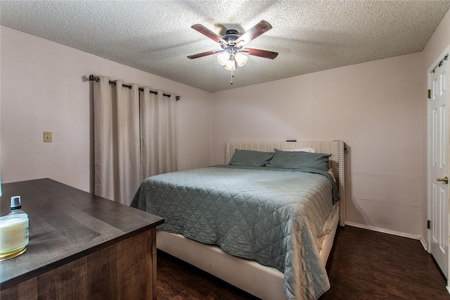 bedroom featuring a textured ceiling, ceiling fan, and dark wood-type flooring