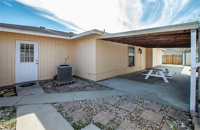 exterior space with cooling unit and a patio