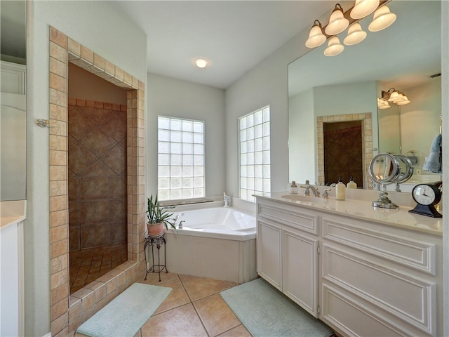 bathroom featuring tile patterned flooring, vanity, and independent shower and bath