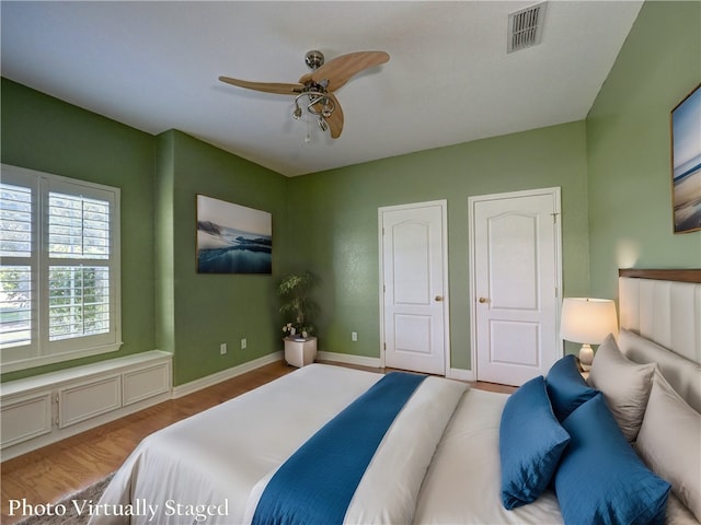 bedroom featuring ceiling fan and light hardwood / wood-style floors