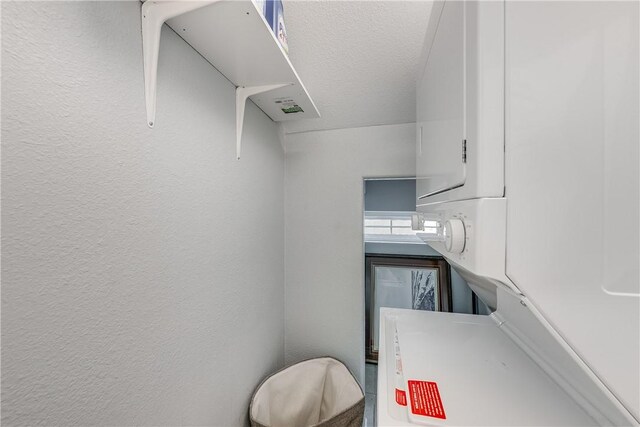 interior space with stacked washer / dryer