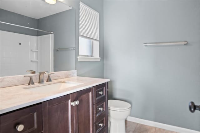 2809 Vancouver Dr, Corpus Christi, TX 78414 - full bathroom with toilet, vanity, a shower, tile patterned flooring, and baseboards