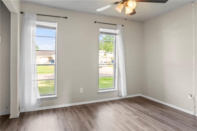 2809 Vancouver Dr, Corpus Christi, TX 78414 - spare room with a ceiling fan, wood finished floors, and baseboards