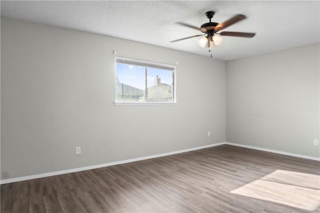 2809 Vancouver Dr, Corpus Christi, TX 78414 - empty room with wood finished floors, a ceiling fan, and baseboards