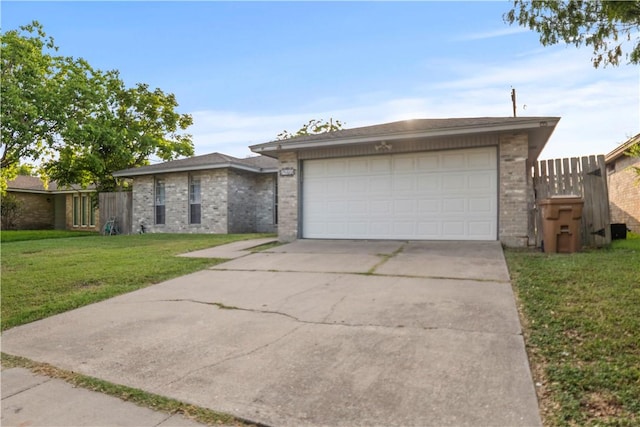 2809 Vancouver Dr, Corpus Christi, TX 78414 - view of front of property featuring brick siding, driveway, and a garage